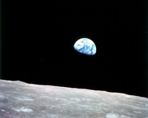 This photo of "Earthrise" over the lunar horizon was taken by the Apollo 8 crew in December 1968, showing Earth for the first time as it appears from deep space