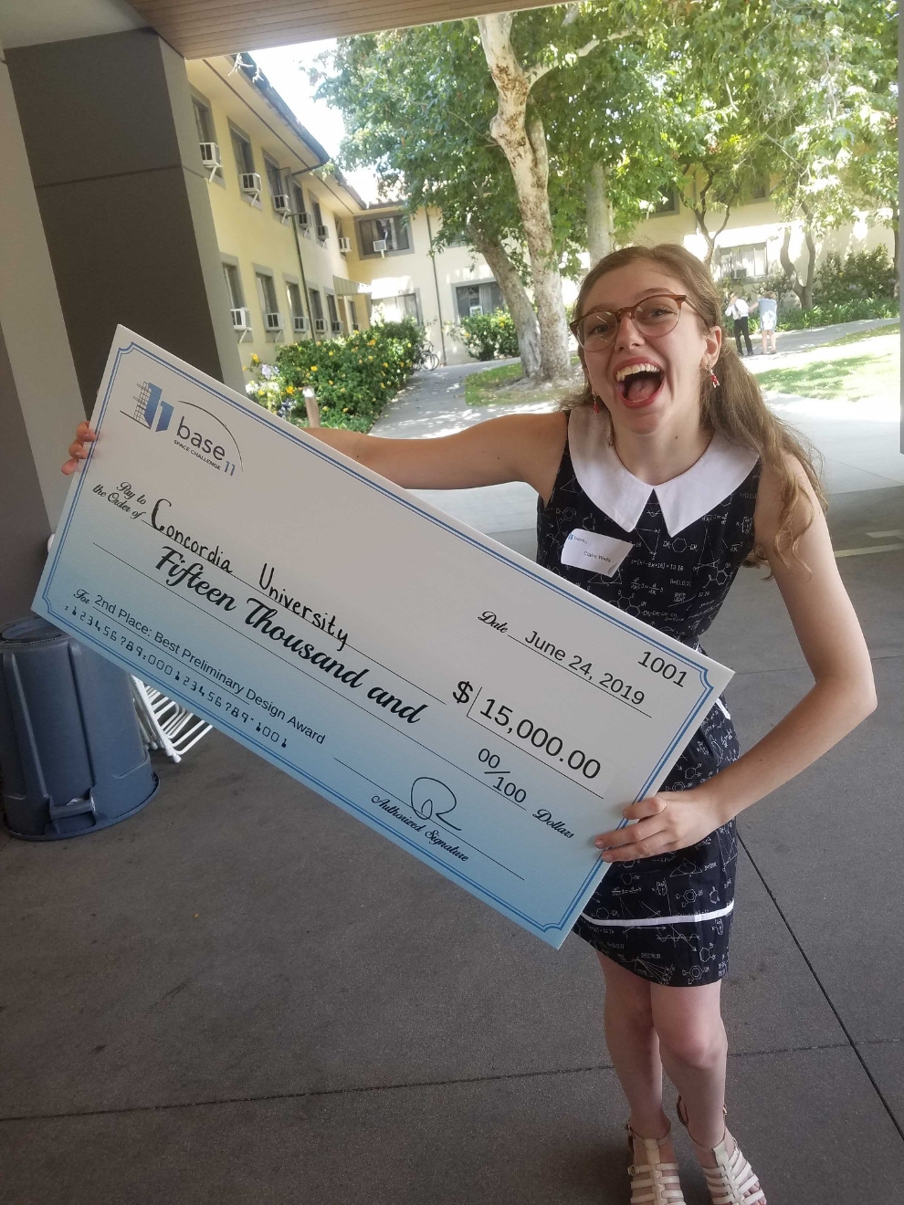 Claire Well of Space Concordia with their 2nd place US$15,000 cheque from the BASE 11 Space Challenge Phase 1 PDR